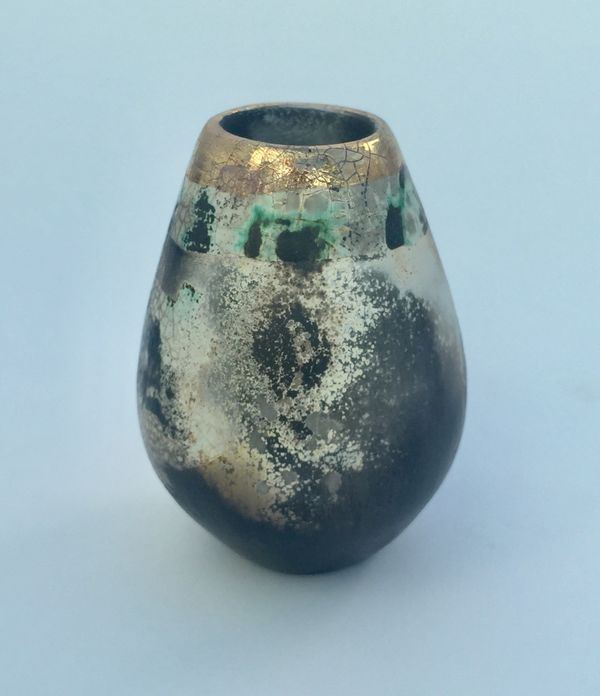 Small upright smoke-fired ceramic pot.