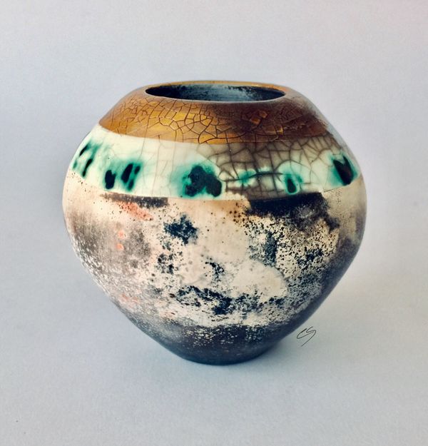 Smoke fired pot with gold.