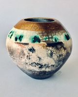 Smoke fired pot with gold.
