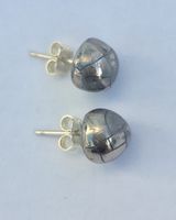 Silver ceramic studs.