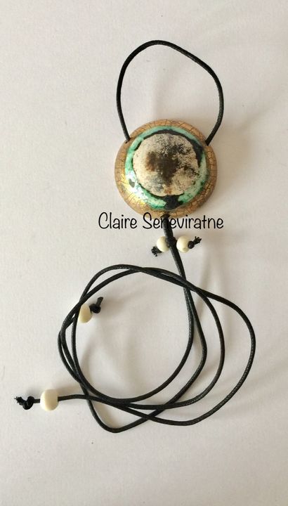 Gold smoke fired pendant.