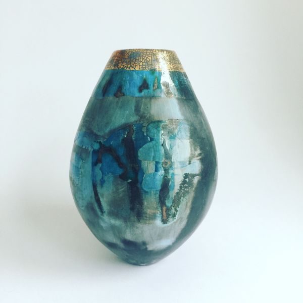 Blue pit-fired ceramic vessel.