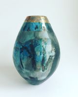 Blue pit-fired ceramic vessel.