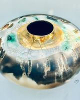 Large round smoke fired pot with gold lustre.
