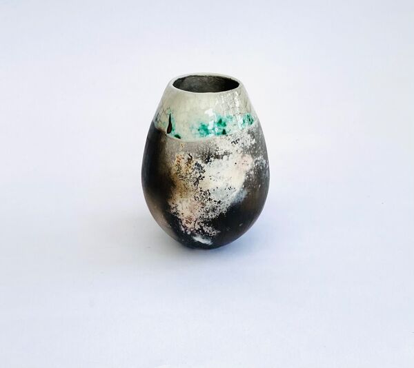 Smoke fired pot with copper carbonate.
