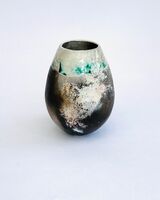 Smoke fired pot with copper carbonate.