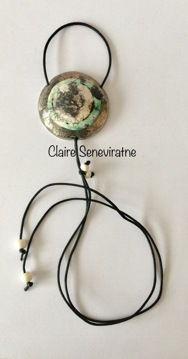 Large silver smoke fired pendant.