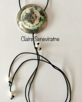 Large silver smoke fired pendant.