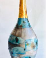 Tall blue smoke-fired pot.