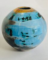 Small blue smoke-fired pot with gold lustre.