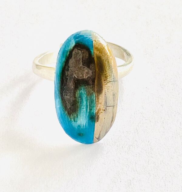 Blue porcelain ring on a sterling silver adjustable band.