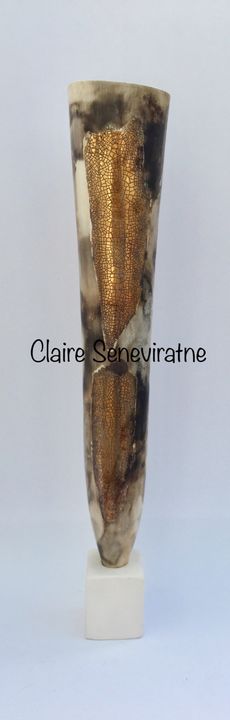 Tall smoke-fired pot with gold lustre.