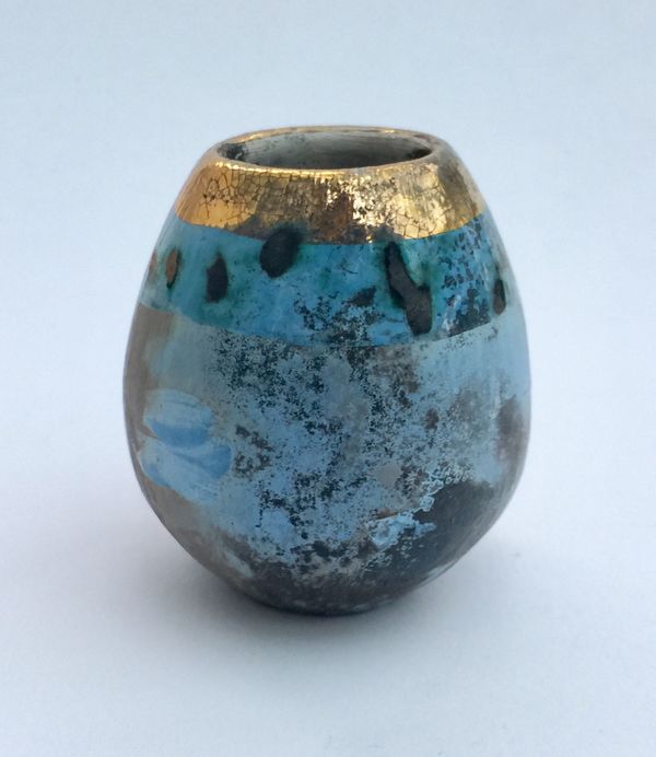 Small blue smoke-fired pot with gold lustre.