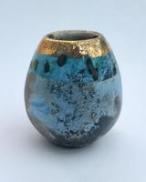 Small blue smoke-fired pot with gold lustre.