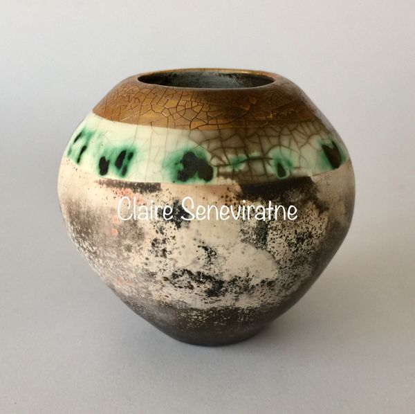 Smoke fired pot with gold.