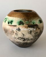 Smoke fired pot with gold.