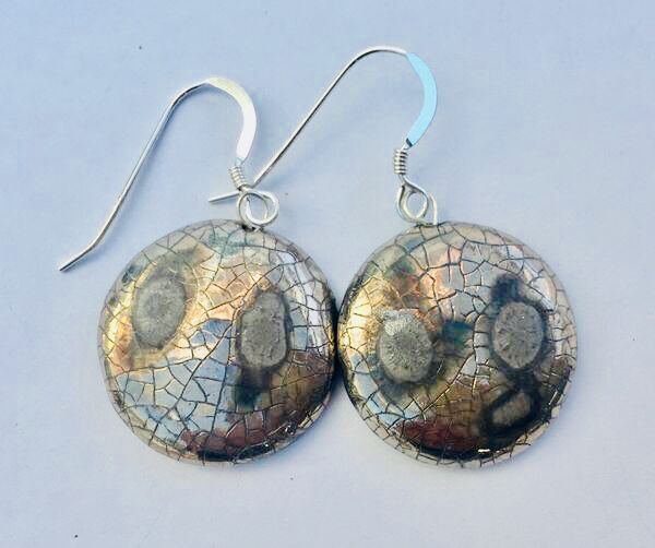 Silver round earrings with crackled glaze.