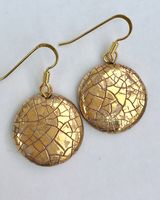 Round ceramic earrings with glaze and gold lustre.