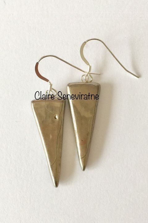 Silver porcelain triangle earrings.