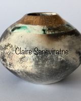 Round smoke fired pot with gold.