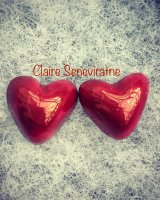 Red lustre heart earrings.
