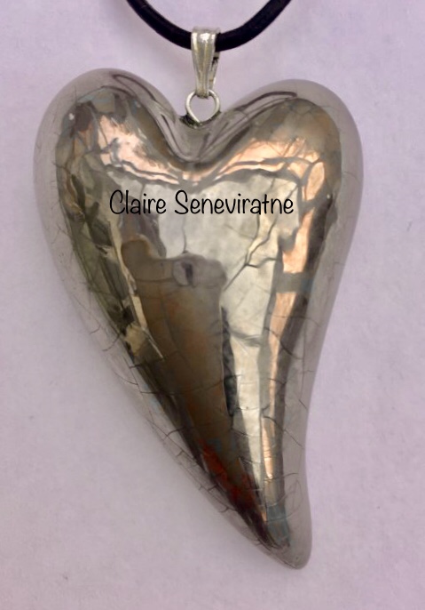 Silver heart pendant.