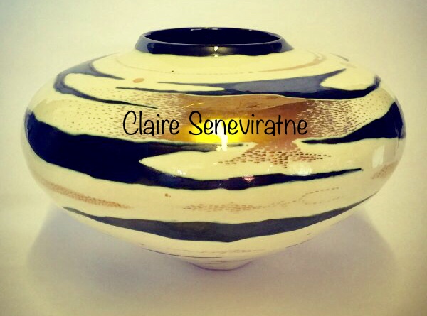 Ceramic pot with gold lustre.