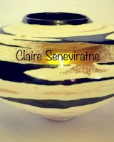 Ceramic pot with gold lustre.