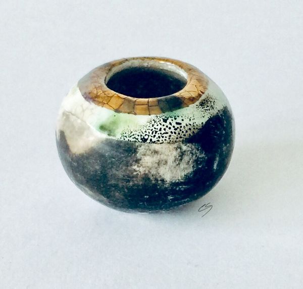 Tiny smoke fired pot.