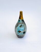 Small blue smoke-fired ceramic pot with gold lustre.