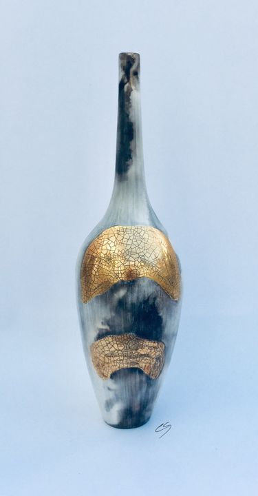 Smoke fired pot with long neck.
