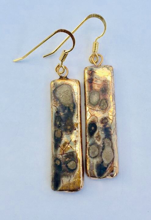 Gold rectangular drop earrings.