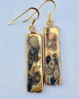 Gold rectangular drop earrings.