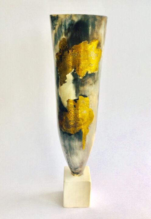 Tall smoke-fired pot with gold lustre on a stand.