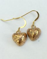 Small gold heart earrings.