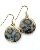 Round ceramic earrings with glaze and gold lustre.