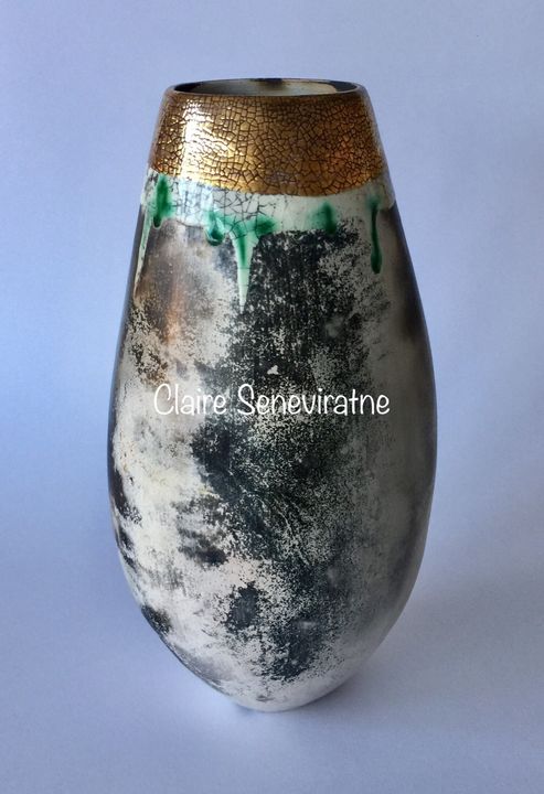 Tall smoke fired pot.