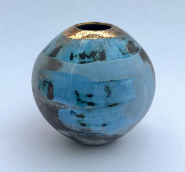 Small blue smoke-fired pot with gold lustre.