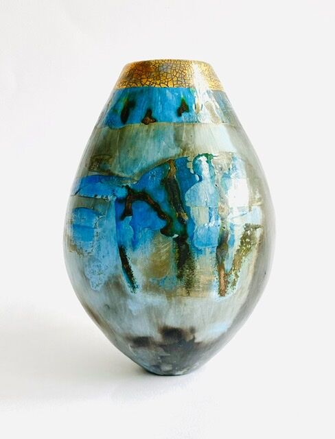 Blue pit-fired ceramic vessel.