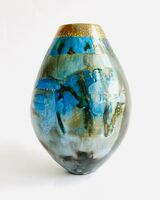 Blue pit-fired ceramic vessel.