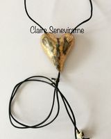 Large gold heart pendant with crackled textures.