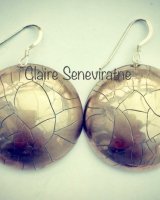 Large round silver earrings.