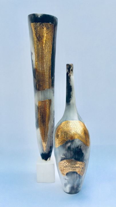 Two smoke-fired pots with gold lustre.