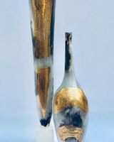 Two smoke-fired pots with gold lustre.