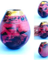Red smoke-fired pot with gold lustre.