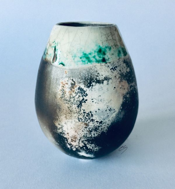Smoke fired pot with copper carbonate.