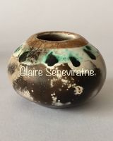 Small smoke fired pot with gold.