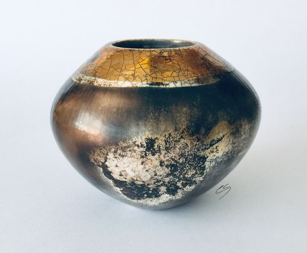 Smoke fired pot with gold.