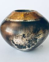 Smoke fired pot with gold.
