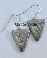 Silver triangle earrings.